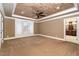 Spacious bedroom featuring neutral tones, a tray ceiling with a ceiling fan, and a window with natural light at 915 Dunleigh Dr, Burlington, NC 27215