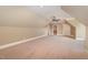 Bright bonus room features neutral walls, carpet, and ceiling fan with access to additional rooms at 915 Dunleigh Dr, Burlington, NC 27215