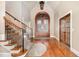 Elegant foyer with hardwood floors, grand staircase and decorative lighting at 915 Dunleigh Dr, Burlington, NC 27215