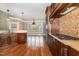 Open kitchen with stainless steel appliances, tile backsplash, and scenic view at 915 Dunleigh Dr, Burlington, NC 27215