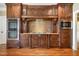 Chef's kitchen with stainless appliances, custom wood cabinets, and granite countertops at 915 Dunleigh Dr, Burlington, NC 27215