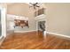 Open-concept living space with hardwood floors, high ceilings, and kitchen view at 915 Dunleigh Dr, Burlington, NC 27215