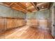 Office with wood paneled walls, coffered ceiling and hardwood floors at 915 Dunleigh Dr, Burlington, NC 27215