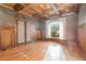 Office showcasing wood paneled walls, coffered ceiling and large window at 915 Dunleigh Dr, Burlington, NC 27215