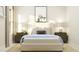 Stylish bedroom highlights a well-made bed, decorative pillows, lamps, and coordinating nightstands at 920 Jasper Mine Trl, Raleigh, NC 27610