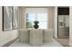 Dining room with modern seating, neutral colors, and stainless refrigerator creating an inviting space at 920 Jasper Mine Trl, Raleigh, NC 27610