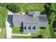 Aerial shot of the home showcasing its roof, surrounding greenery, and driveway at 98 Lochridge Dr, Roxboro, NC 27573
