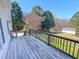 Wooden back deck overlooking a large backyard at 98 Lochridge Dr, Roxboro, NC 27573