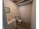 Basement bathroom with a vanity sink, toilet, and basic fixtures for functionality at 98 Lochridge Dr, Roxboro, NC 27573