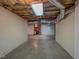 Basement featuring a brick fireplace and ample open space for recreation or storage at 98 Lochridge Dr, Roxboro, NC 27573