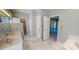 Bathroom with double sinks, tile floor and access to closets at 98 Lochridge Dr, Roxboro, NC 27573