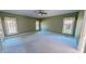 Spacious bedroom with crown molding, large windows, and ceiling fan at 98 Lochridge Dr, Roxboro, NC 27573