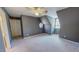 Bedroom features a ceiling fan, neutral gray walls, and an arched window for natural light at 98 Lochridge Dr, Roxboro, NC 27573