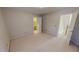 Large bedroom featuring neutral walls, plush carpeting, and an open door leading to a bathroom at 98 Lochridge Dr, Roxboro, NC 27573