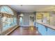 Breakfast nook off the kitchen features large windows and hardwood floors at 98 Lochridge Dr, Roxboro, NC 27573