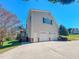 View of the home's exterior showing three car garage and screened porch at 98 Lochridge Dr, Roxboro, NC 27573