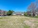 Traditional-style home with a charming front porch and well-manicured lawn at 98 Lochridge Dr, Roxboro, NC 27573