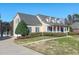 Charming home with a manicured lawn and three dormer windows at 98 Lochridge Dr, Roxboro, NC 27573