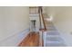 Foyer with hardwood floors and a staircase leading to the upper level at 98 Lochridge Dr, Roxboro, NC 27573