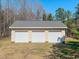 View of the detached three-car garage at 98 Lochridge Dr, Roxboro, NC 27573