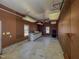 Spacious garage with pegboard walls, storage, and ample workspace with two windows at 98 Lochridge Dr, Roxboro, NC 27573
