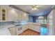 Eat-in kitchen with white appliances and cozy breakfast nook with lots of natural light at 98 Lochridge Dr, Roxboro, NC 27573