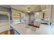 This eat-in kitchen features white cabinets and an expansive countertop perfect for cooking at 98 Lochridge Dr, Roxboro, NC 27573