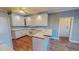 Kitchen with white cabinets and hardwood floors at 98 Lochridge Dr, Roxboro, NC 27573