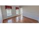 A living room with hardwood floors and lots of natural light at 98 Lochridge Dr, Roxboro, NC 27573