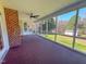 Spacious screened-in porch offering views of the expansive backyard at 98 Lochridge Dr, Roxboro, NC 27573