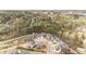 Aerial view of a planned community featuring modern homes and lush green spaces at 104 Chaseford Ct, Holly Springs, NC 27540