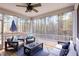 Inviting screened porch offering comfortable seating and serene backyard views at 104 Chaseford Ct, Holly Springs, NC 27540