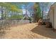 Backyard featuring a wooden fence and a deck with steps, creating a private and functional outdoor area at 105 Damask Rose Dr, Holly Springs, NC 27540