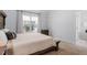 Cozy bedroom with lots of light, carpet, and a comfortable bed at 105 Damask Rose Dr, Holly Springs, NC 27540