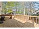 Spacious wood deck with railings offering a great view and space for outdoor dining and entertainment at 105 Damask Rose Dr, Holly Springs, NC 27540