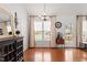 Bright dining area with hardwood floors, natural light, and elegant chandelier at 105 Damask Rose Dr, Holly Springs, NC 27540