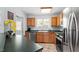 Functional kitchen featuring stainless steel appliances and ample cabinet space at 105 Damask Rose Dr, Holly Springs, NC 27540