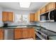 Well-lit kitchen equipped with stainless steel appliances and a functional layout at 105 Damask Rose Dr, Holly Springs, NC 27540