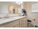 Bright bathroom featuring a double vanity, shower/tub combo, and granite countertops at 1102 Dartmouth Dr, Mebane, NC 27302