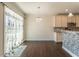 Dining area with chandelier and sliding glass door at 1102 Dartmouth Dr, Mebane, NC 27302