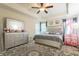Spacious main bedroom featuring a tray ceiling, neutral carpet, and decorative accents at 1102 Dartmouth Dr, Mebane, NC 27302