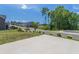 Scenic street view with landscaped homes, greenery, and a smooth concrete driveway at 1102 Dartmouth Dr, Mebane, NC 27302