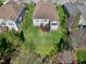 Aerial shot of a landscaped yard with a backyard deck and mature trees at 11129 Bayberry Hills Dr, Raleigh, NC 27617