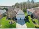 Stunning aerial view of a home highlighting its manicured lawn, mature trees, and neighborhood at 11129 Bayberry Hills Dr, Raleigh, NC 27617