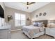 This bedroom has a ceiling fan and natural light, offering a cozy retreat at 11129 Bayberry Hills Dr, Raleigh, NC 27617