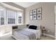 This bedroom provides natural light and views from its bay window with built-in storage at 11129 Bayberry Hills Dr, Raleigh, NC 27617