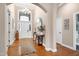 Elegant foyer with hardwood floors, arched entry, chandelier, and views to the front door at 11129 Bayberry Hills Dr, Raleigh, NC 27617