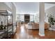 Bright living room with hardwood floors, stone fireplace, and stylish bar cart area at 11129 Bayberry Hills Dr, Raleigh, NC 27617