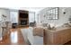 Cozy living room featuring a stone fireplace, hardwood floors, and comfortable seating at 11129 Bayberry Hills Dr, Raleigh, NC 27617