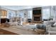 Open-concept living room featuring a stone fireplace, breakfast bar, and cozy seating at 11129 Bayberry Hills Dr, Raleigh, NC 27617